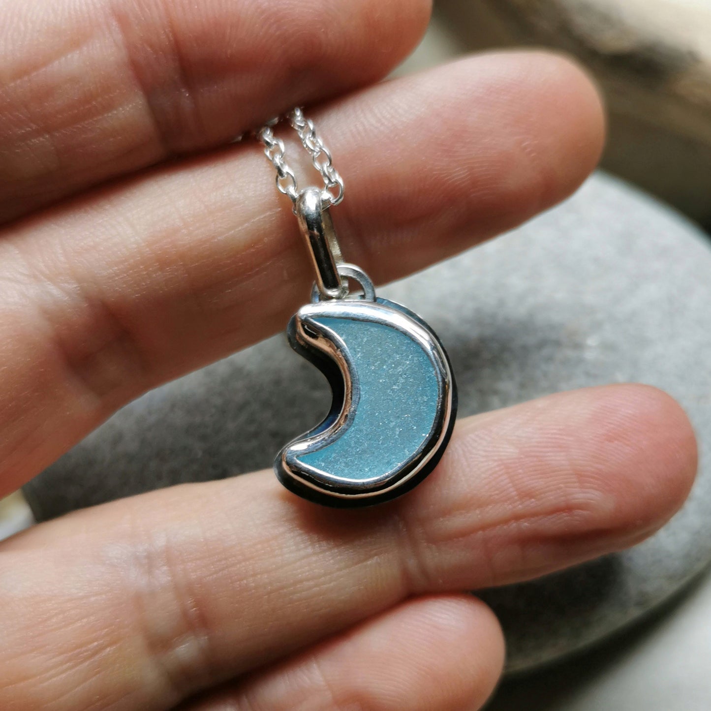 Aqua crescent moon sea glass & sterling silver pendant.