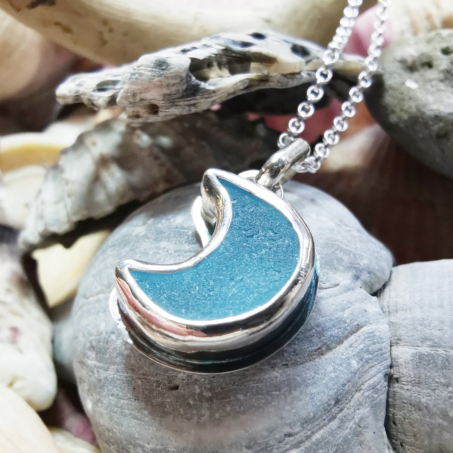 Aqua crescent moon sea glass & sterling silver pendant.