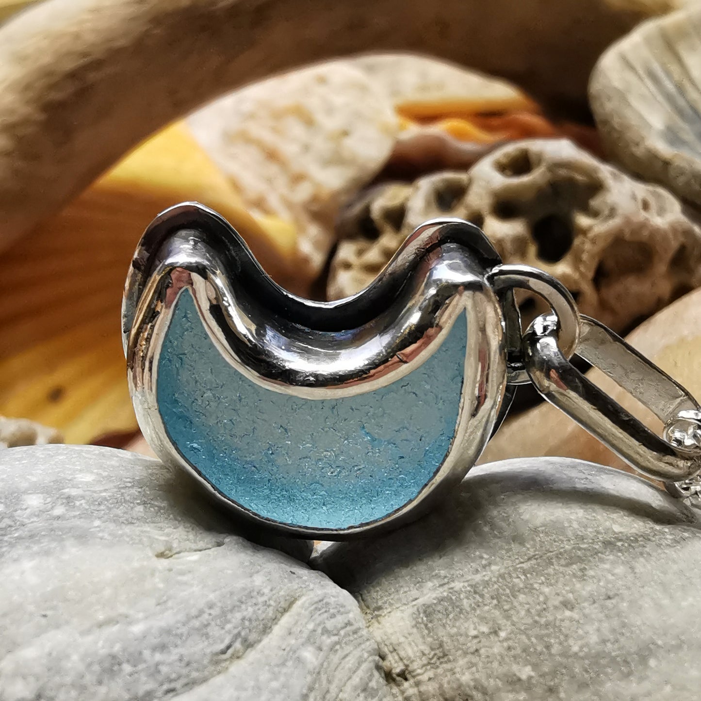Aqua crescent moon sea glass & sterling silver pendant.