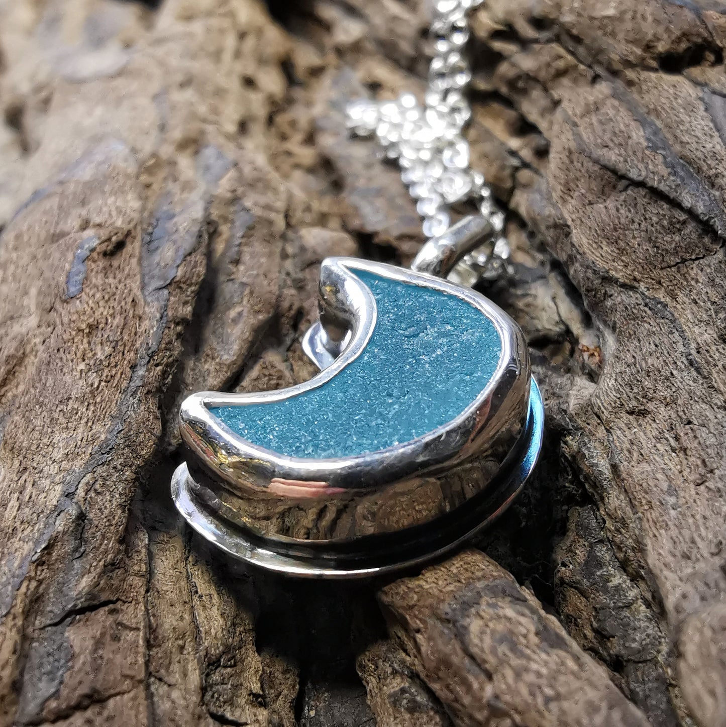Aqua crescent moon sea glass & sterling silver pendant.