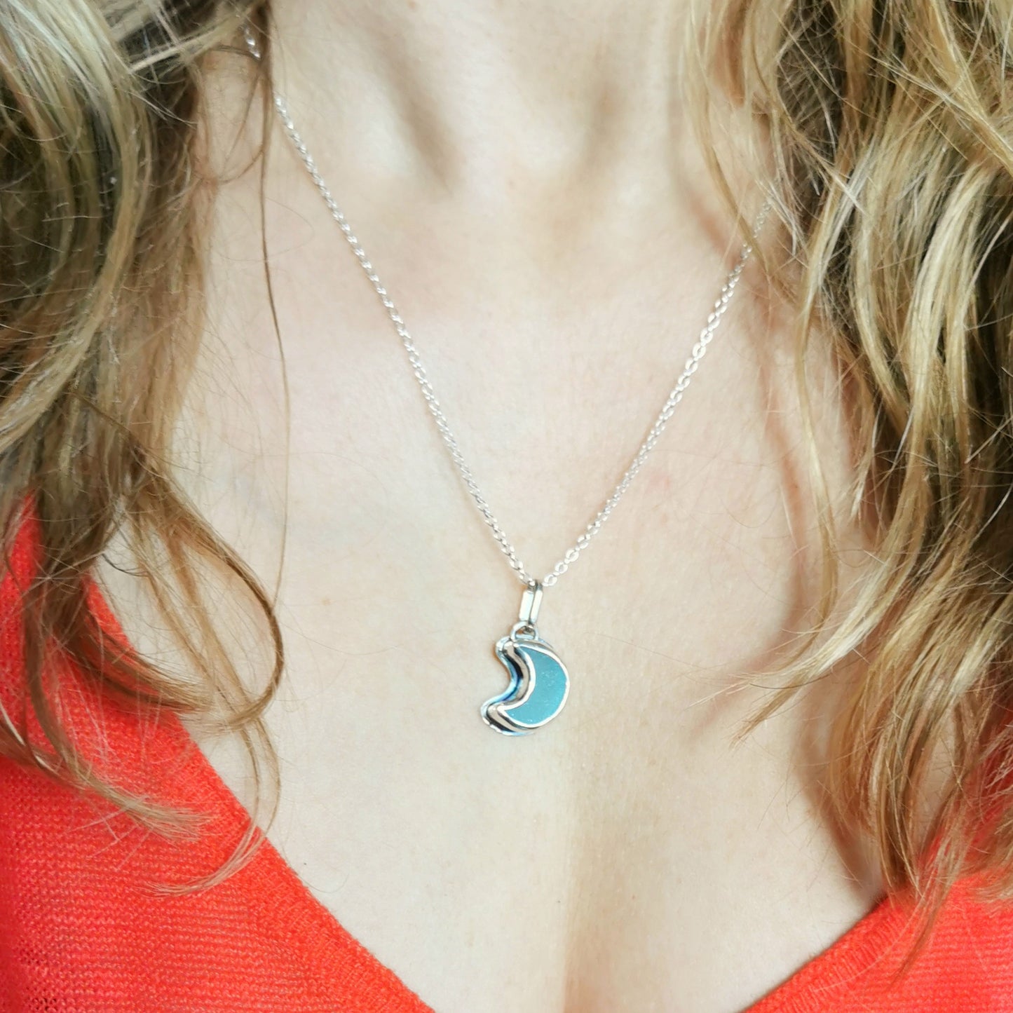 Aqua crescent moon sea glass & sterling silver pendant.