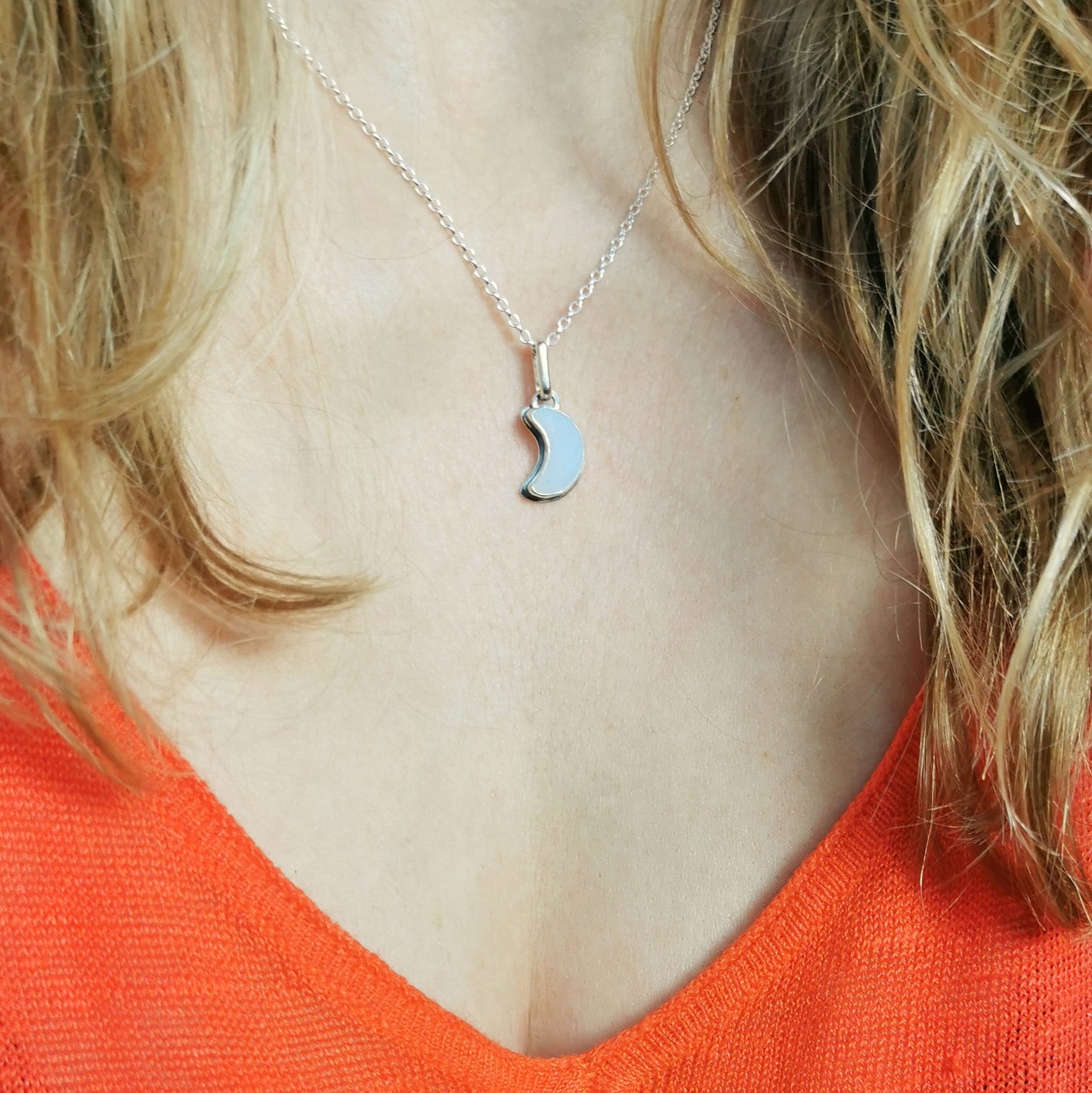 Opalescent crescent moon sea glass & sterling silver pendant.