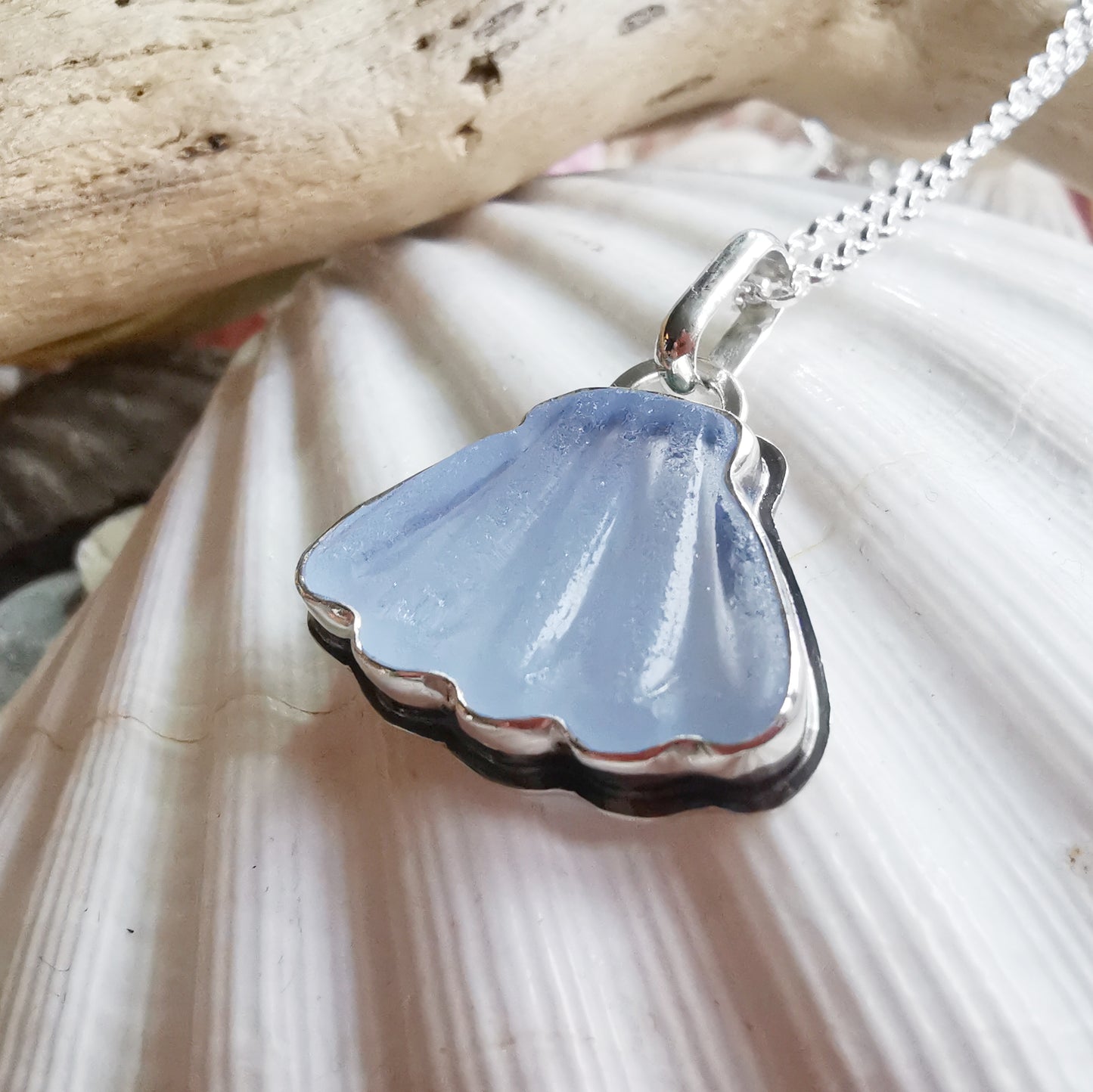 Light blue sea glass shell & sterling silver pendant.