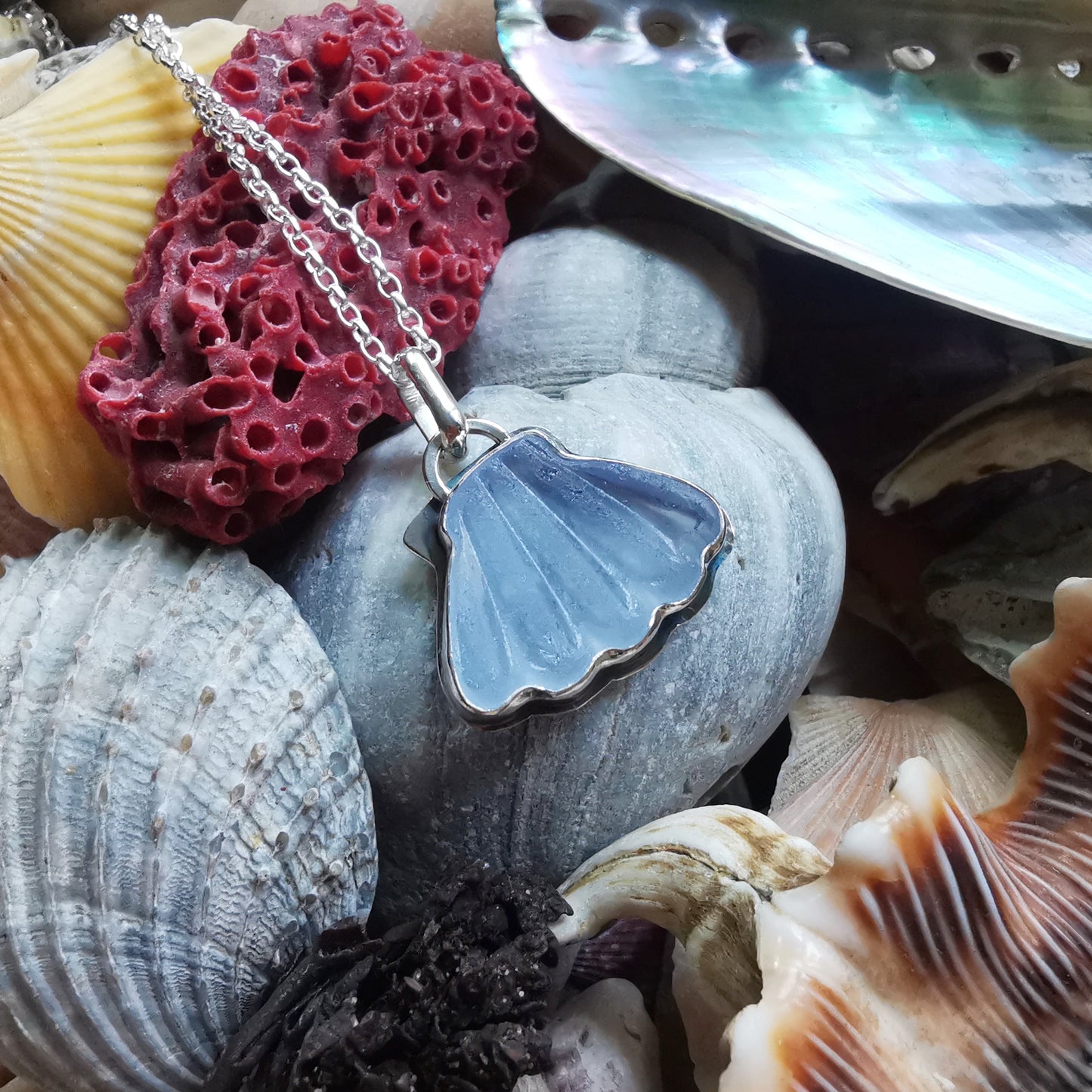 Light blue sea glass shell & sterling silver pendant.