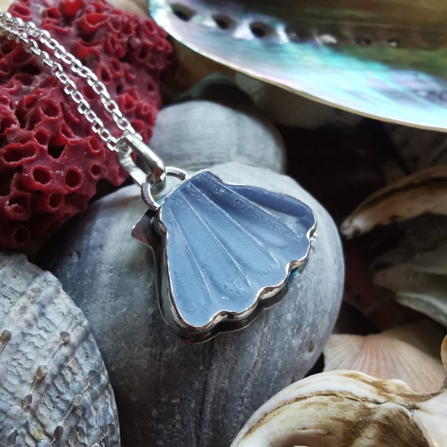 Light blue sea glass shell & sterling silver pendant.