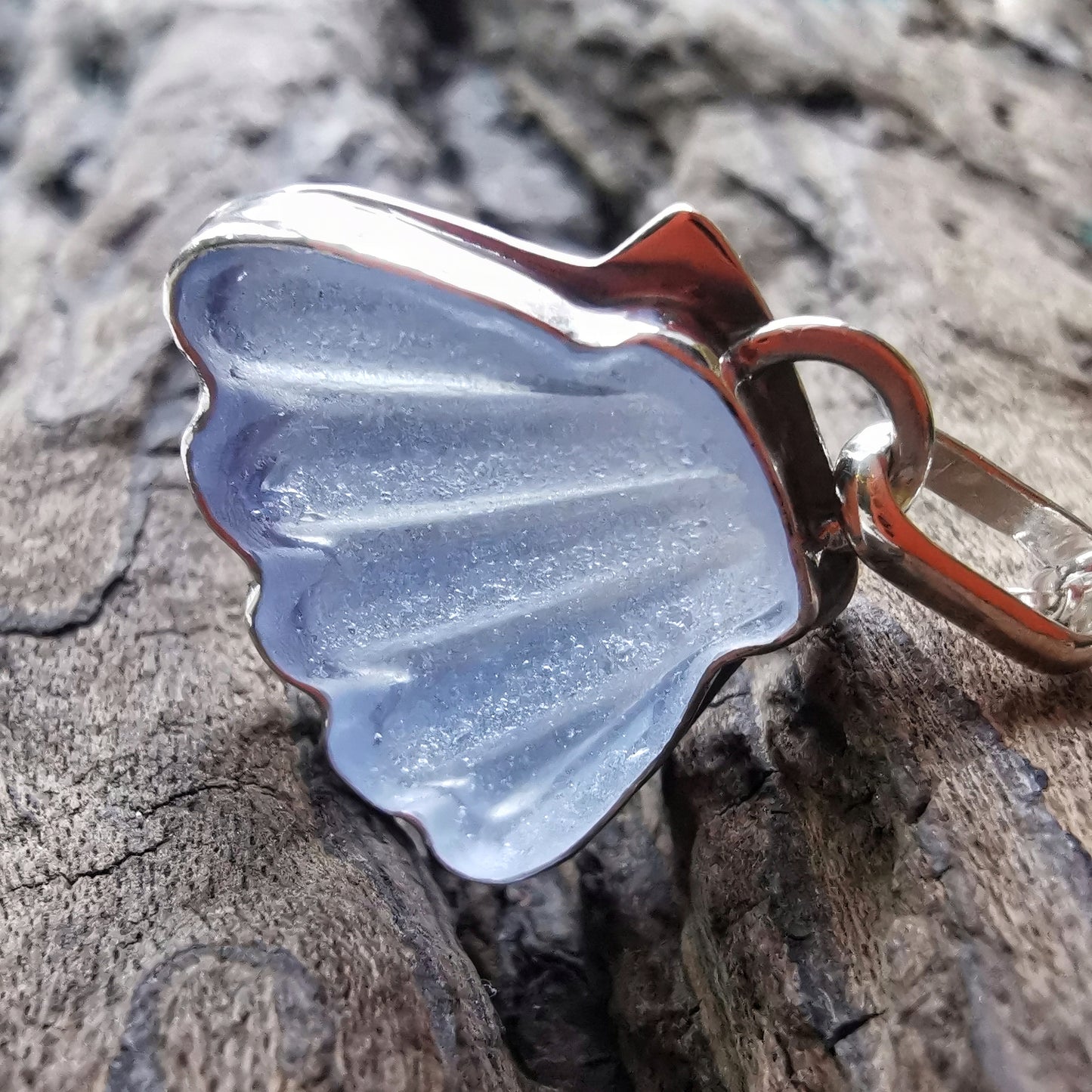 Light blue sea glass shell & sterling silver pendant.