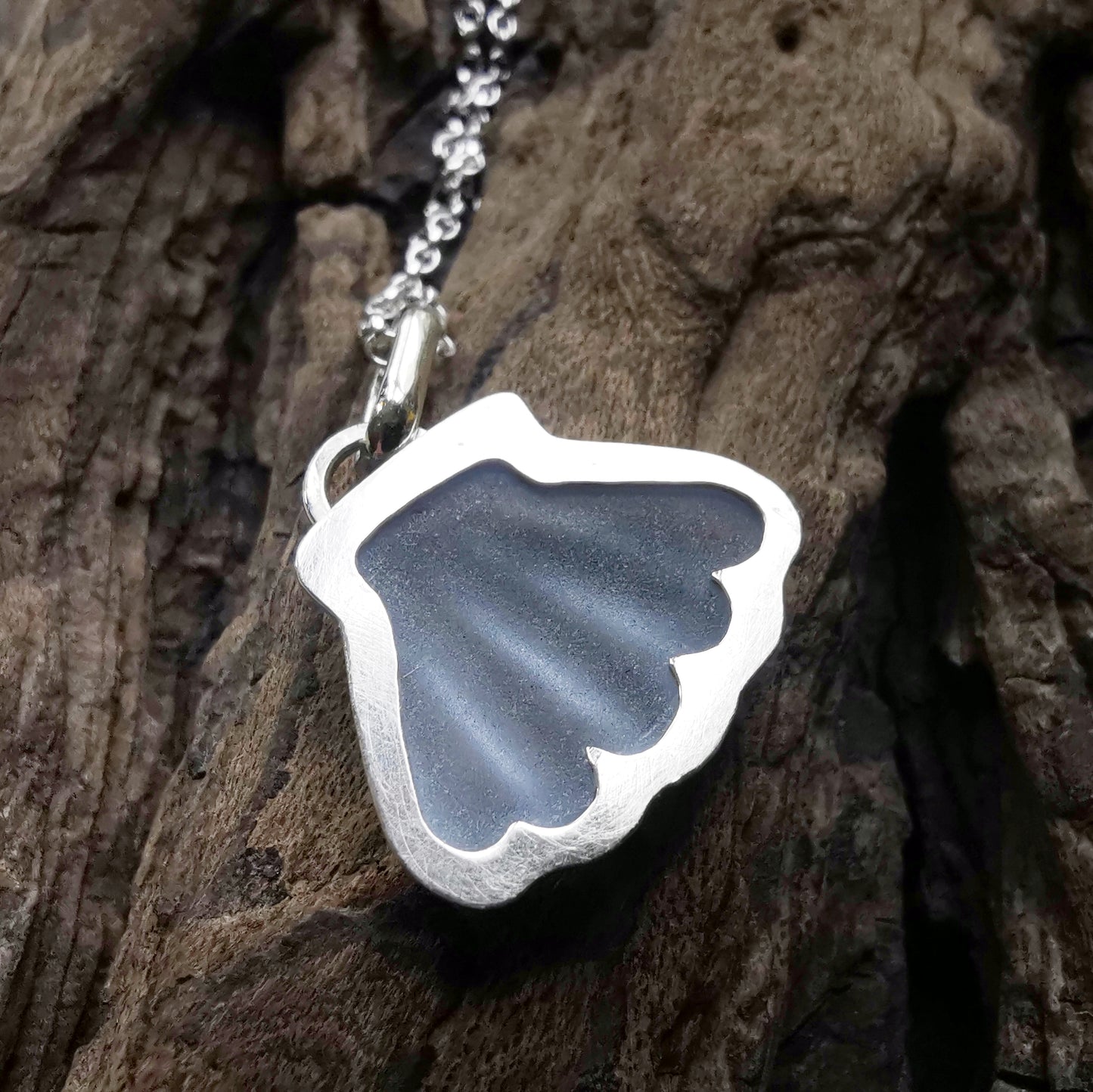 Light blue sea glass shell & sterling silver pendant.