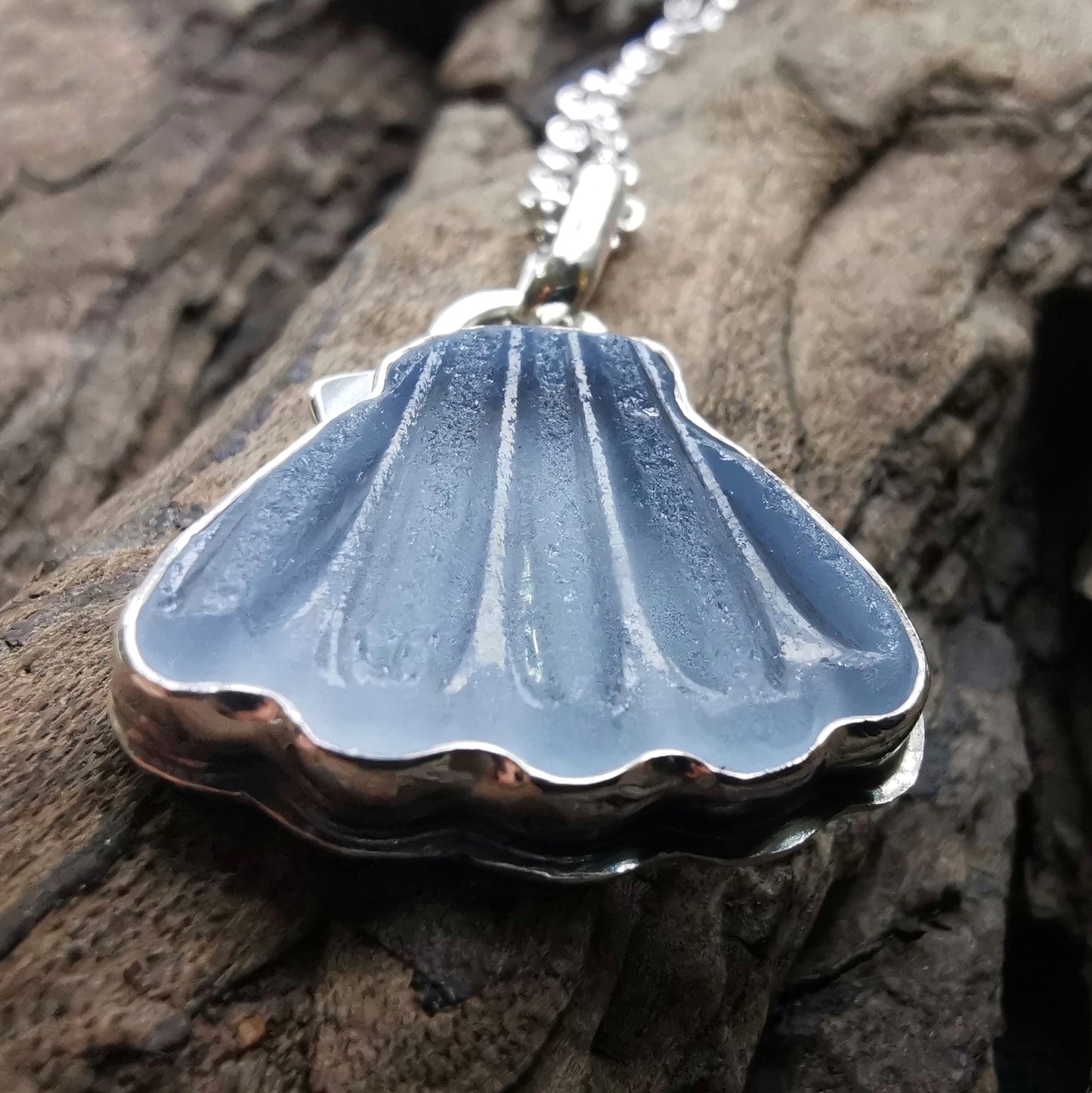 Light blue sea glass shell & sterling silver pendant.
