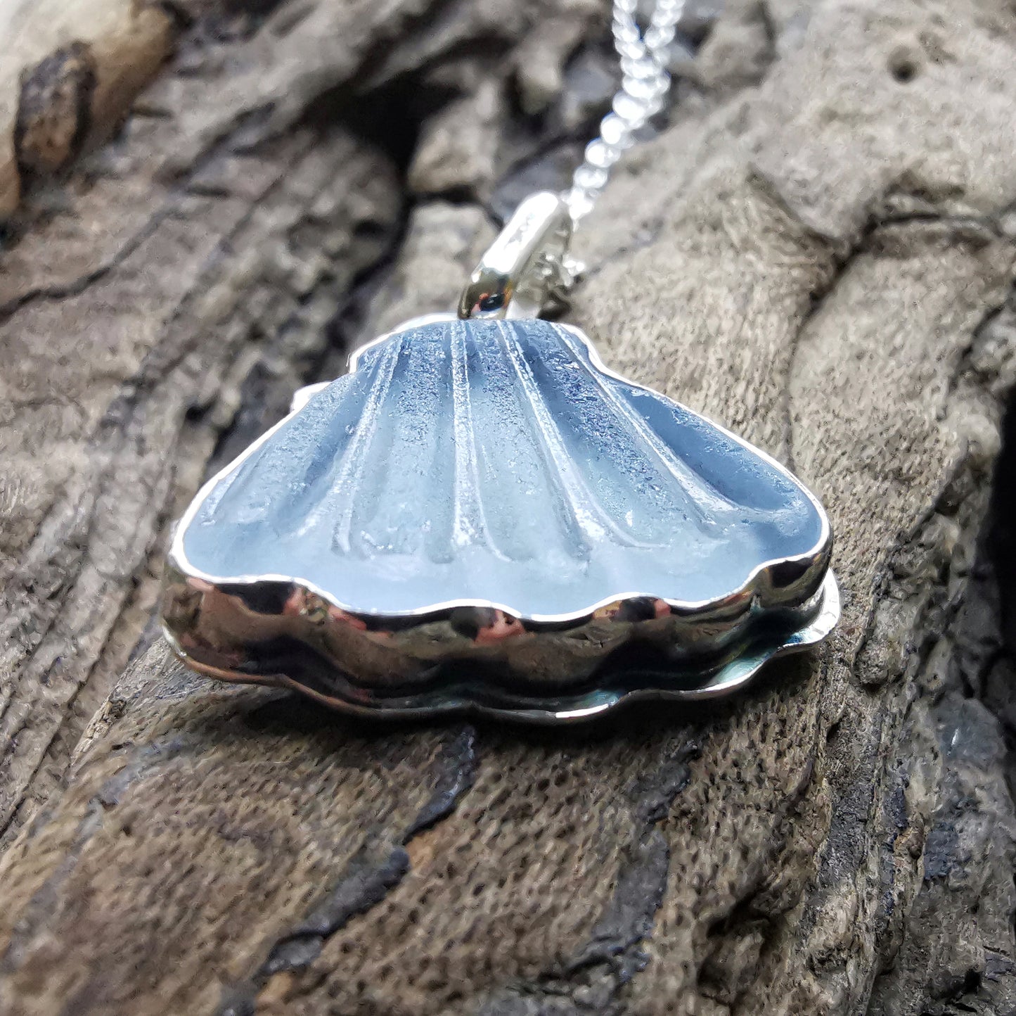 Light blue sea glass shell & sterling silver pendant.