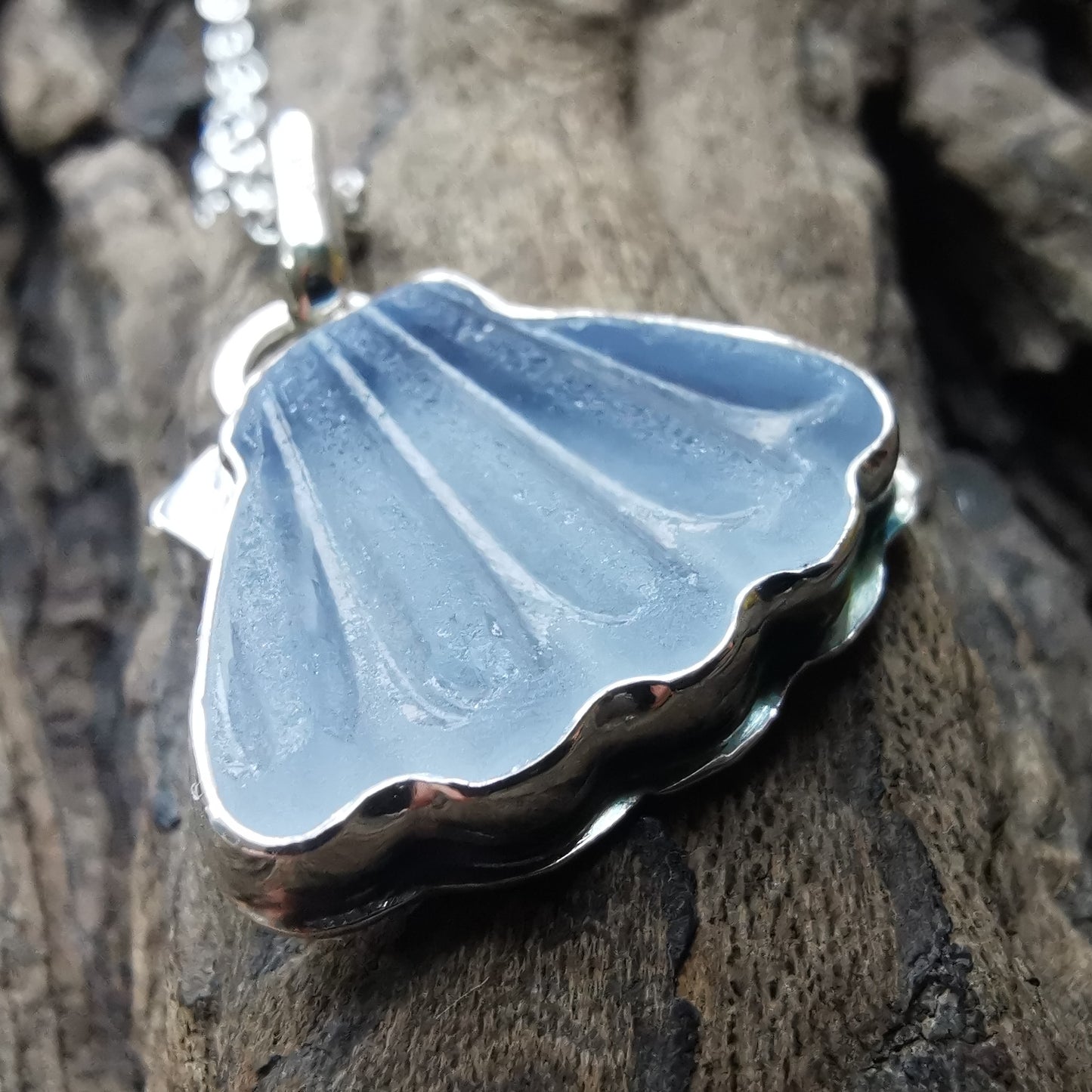 Light blue sea glass shell & sterling silver pendant.