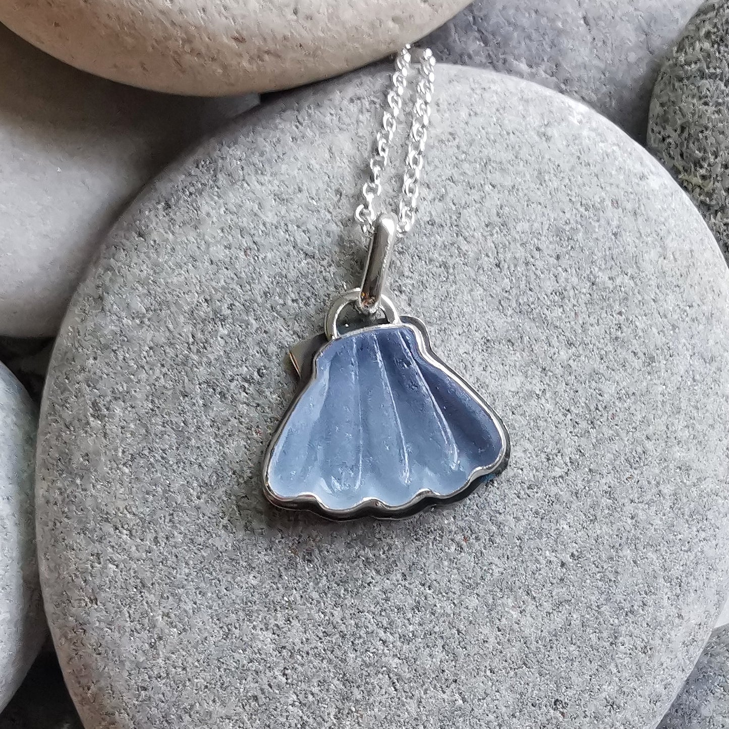 Light blue sea glass shell & sterling silver pendant.