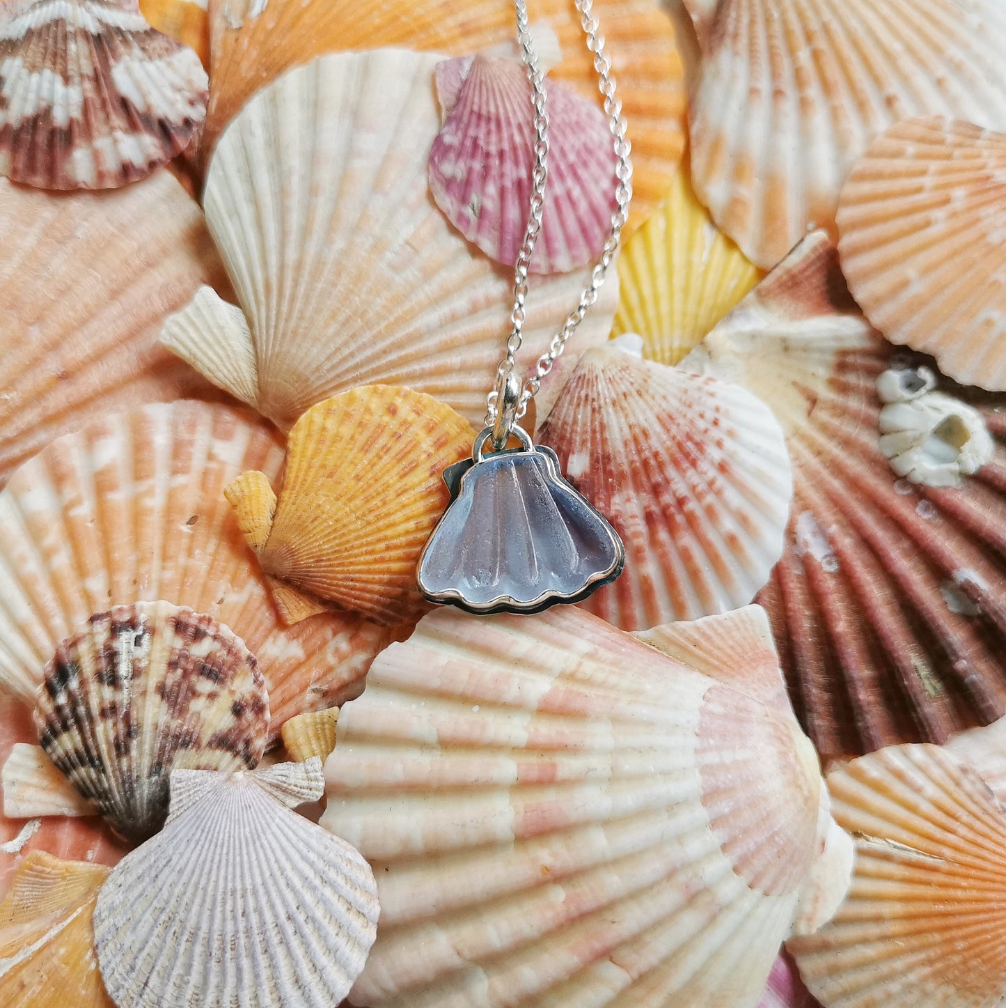 Light blue sea glass shell & sterling silver pendant.