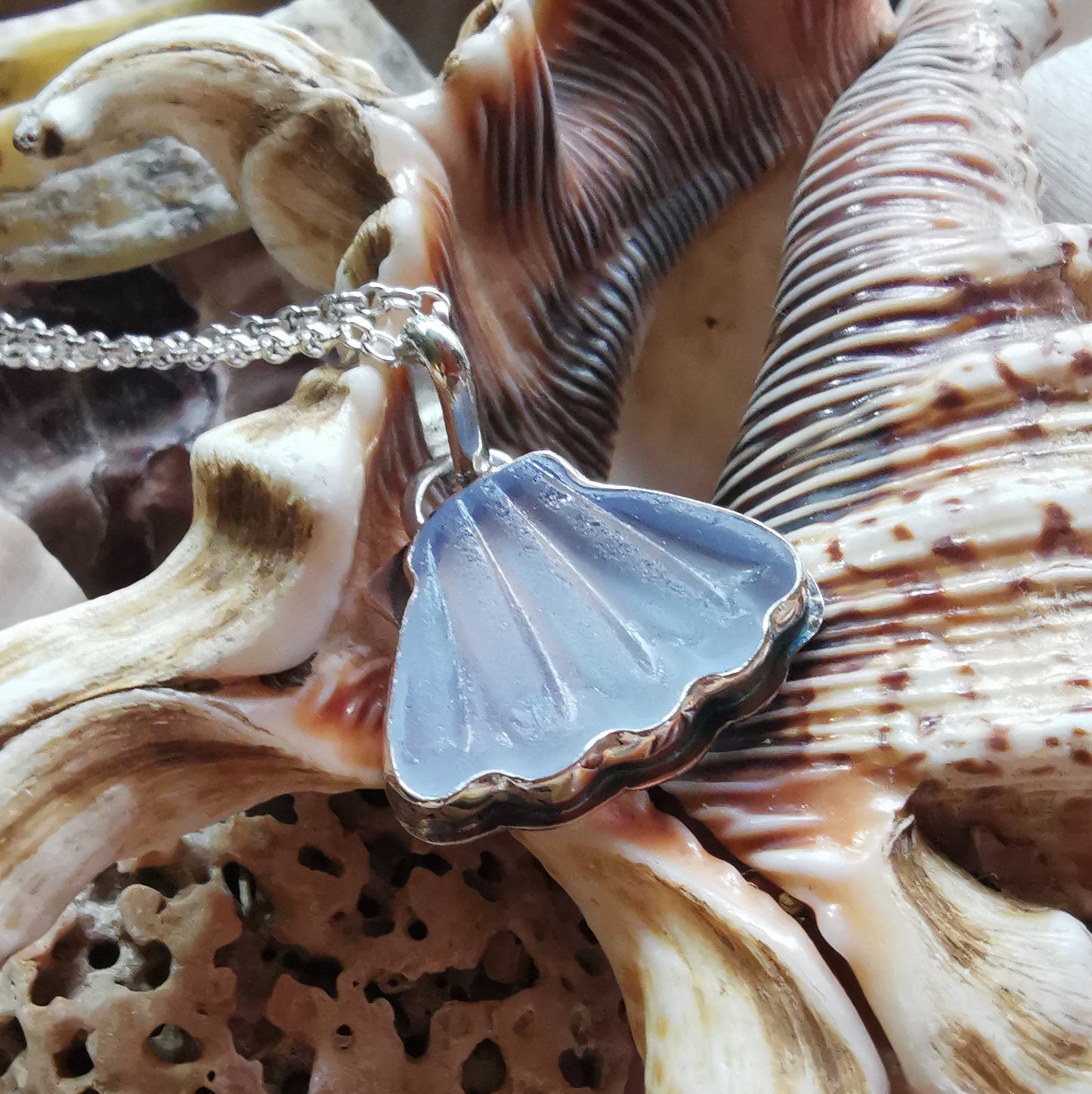 Light blue sea glass shell & sterling silver pendant.