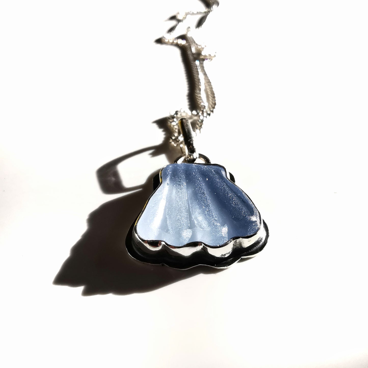 Light blue sea glass shell & sterling silver pendant.