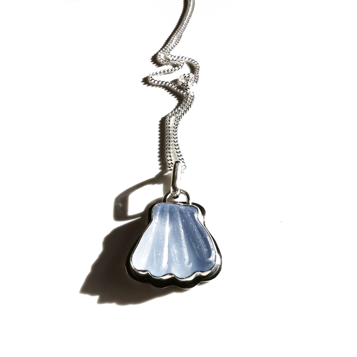 Light blue sea glass shell & sterling silver pendant.