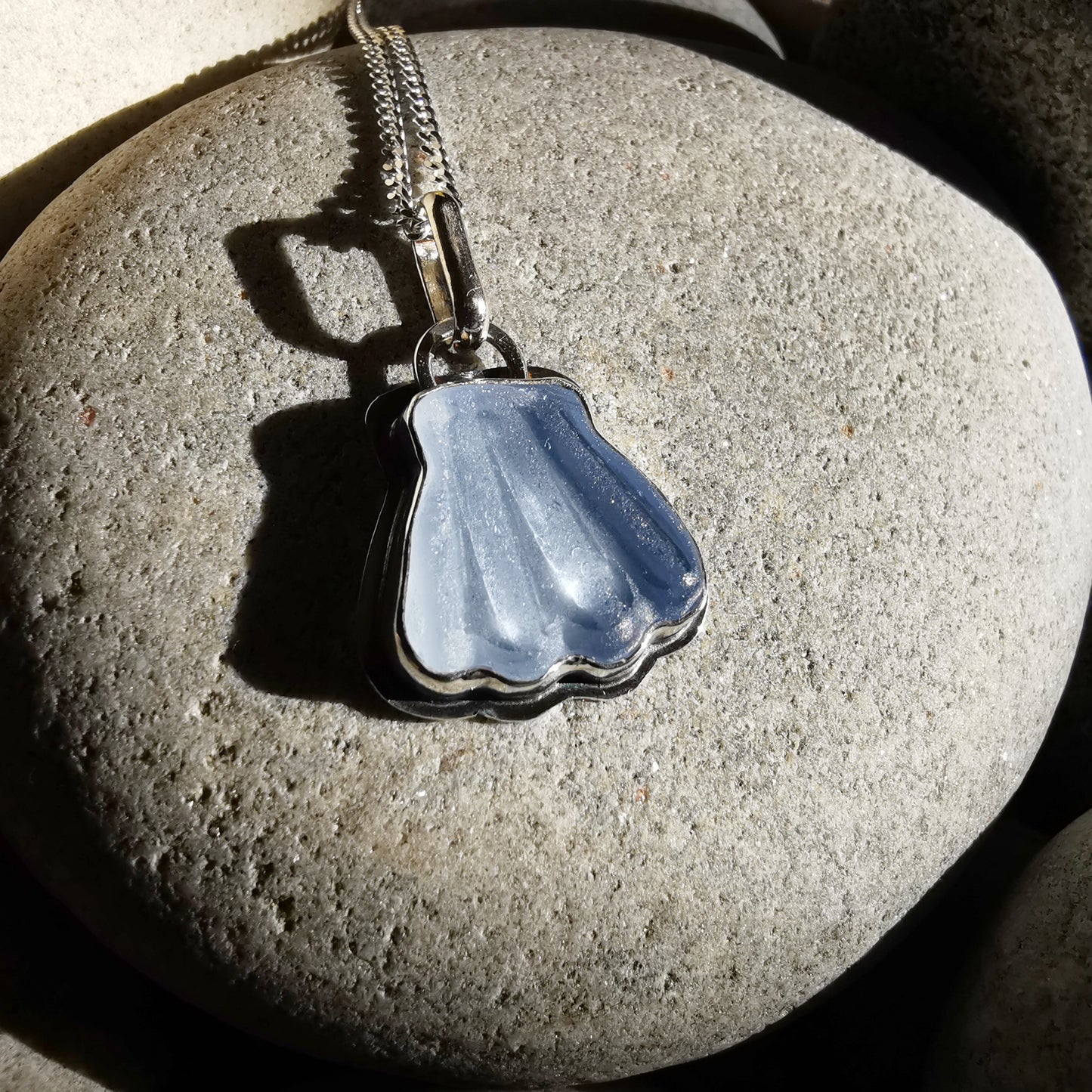 Light blue sea glass shell & sterling silver pendant.