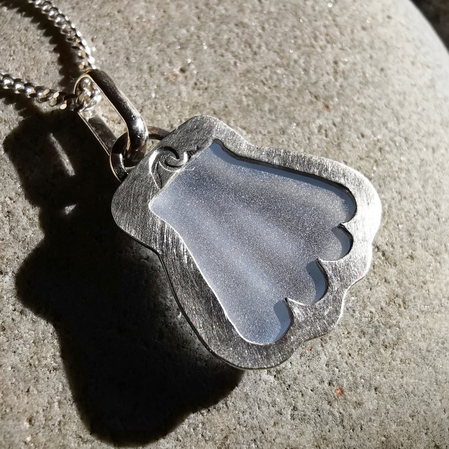 Light blue sea glass shell & sterling silver pendant.