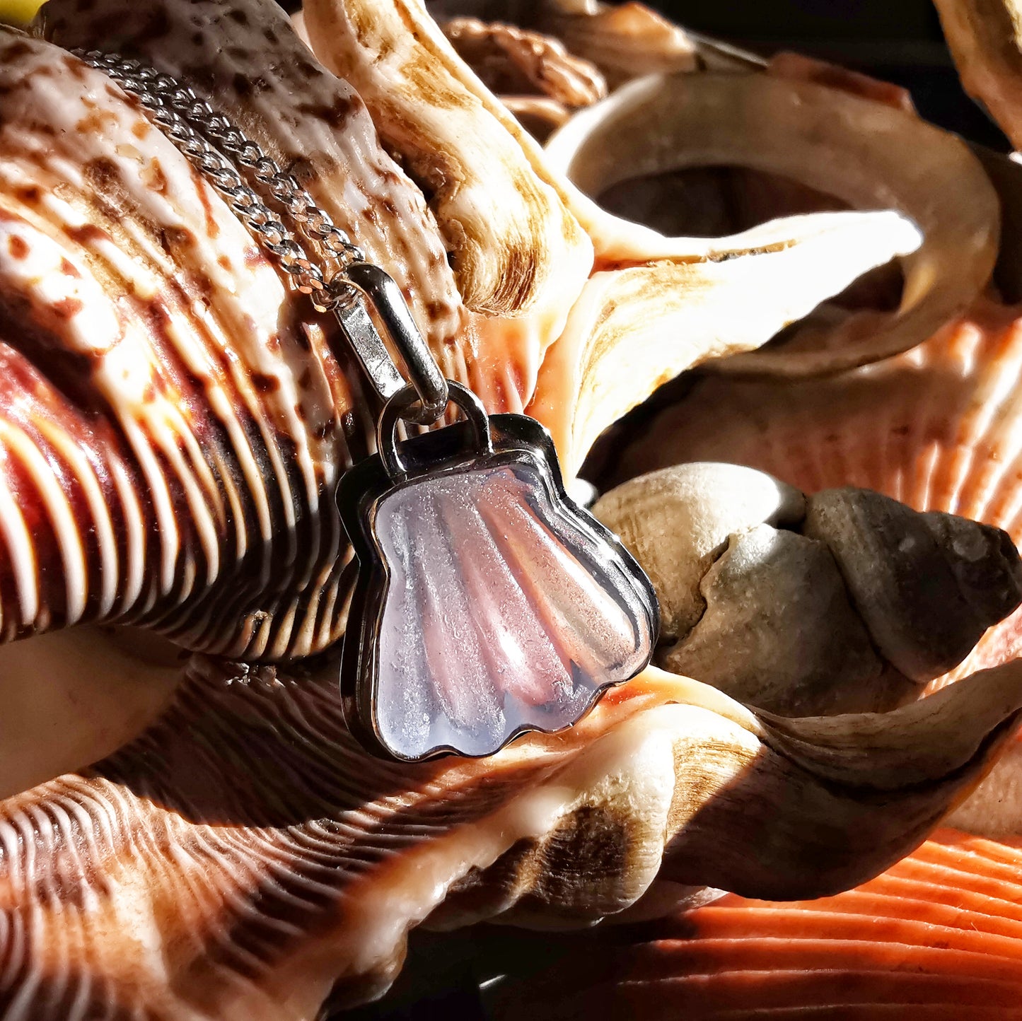 Light blue sea glass shell & sterling silver pendant.