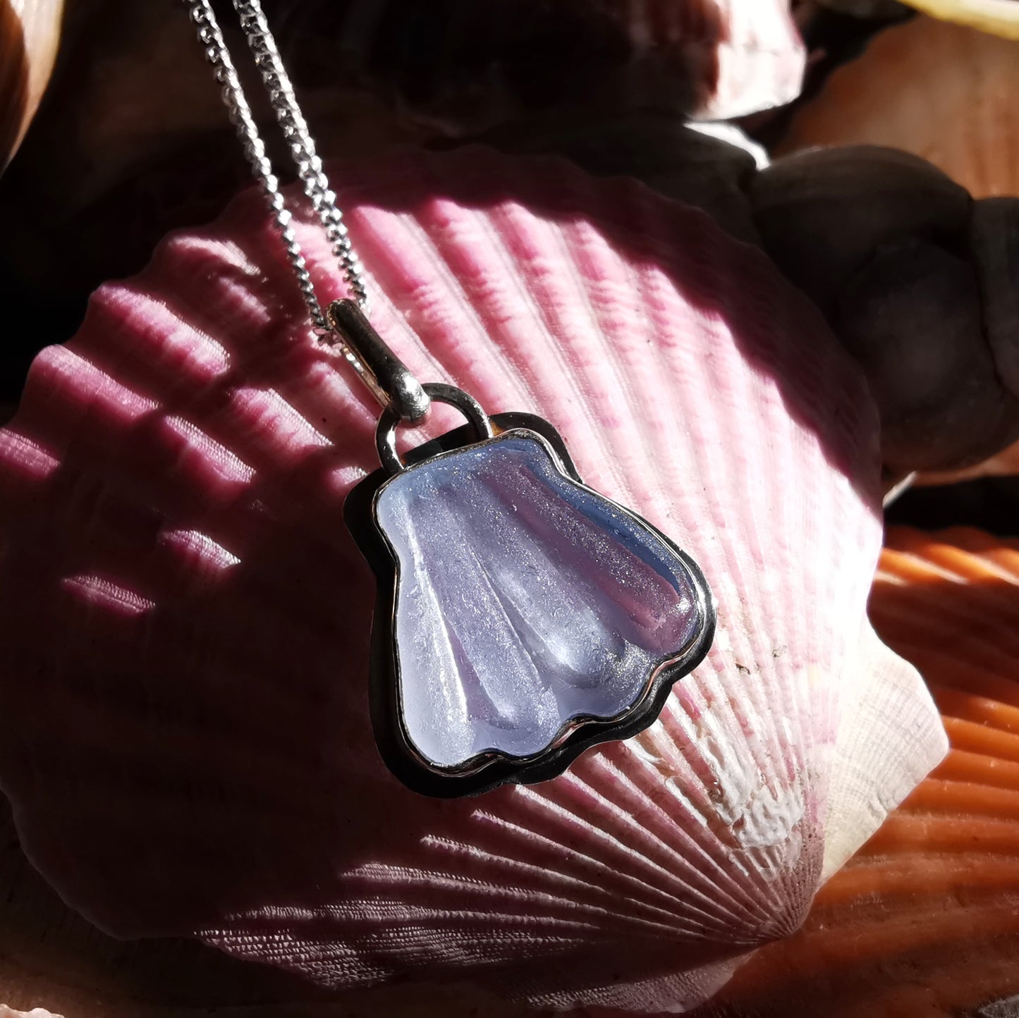 Light blue sea glass shell & sterling silver pendant.