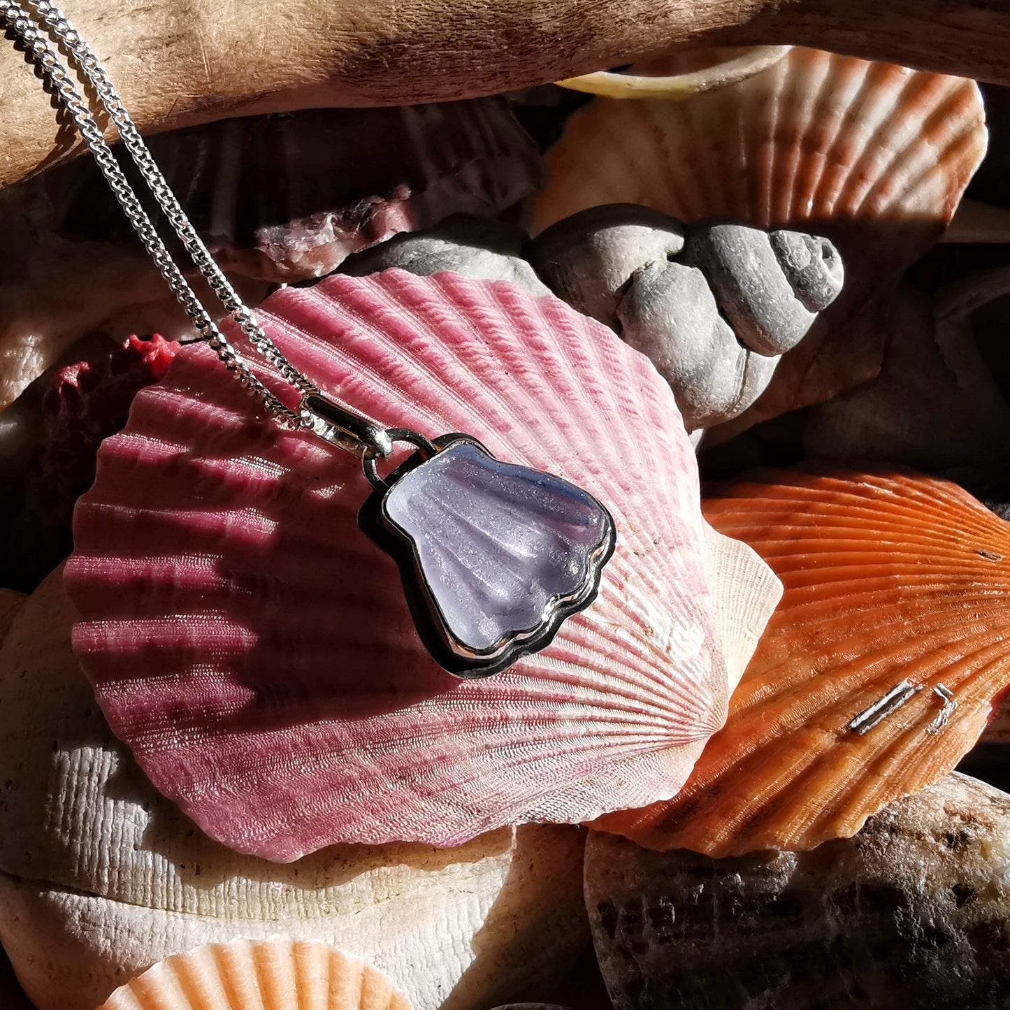 Light blue sea glass shell & sterling silver pendant.