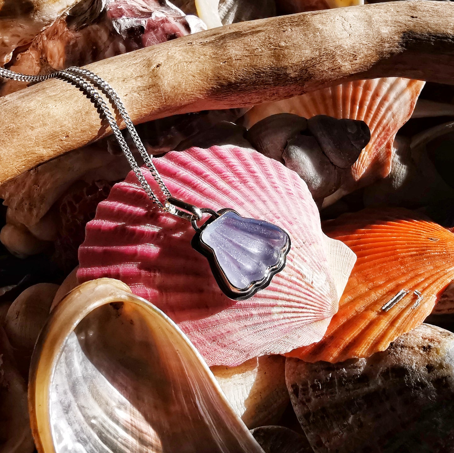 Light blue sea glass shell & sterling silver pendant.