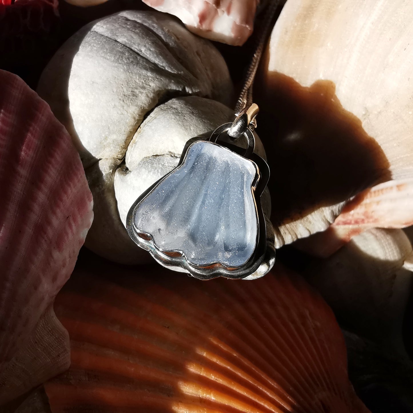 Light blue sea glass shell & sterling silver pendant.