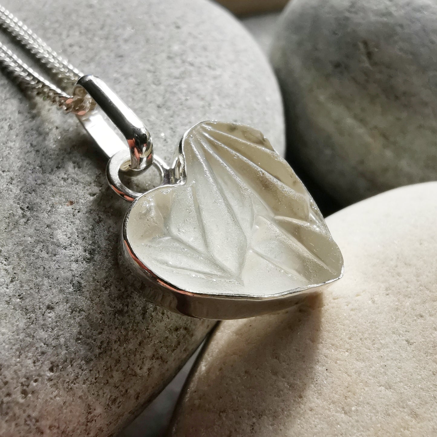 Clear sea glass heart & sterling silver pendant.