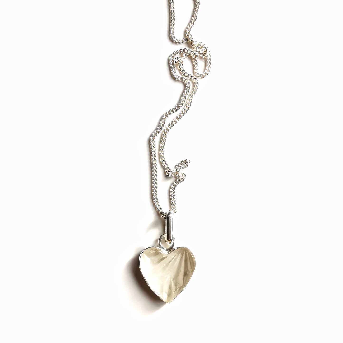 Clear sea glass heart & sterling silver pendant.