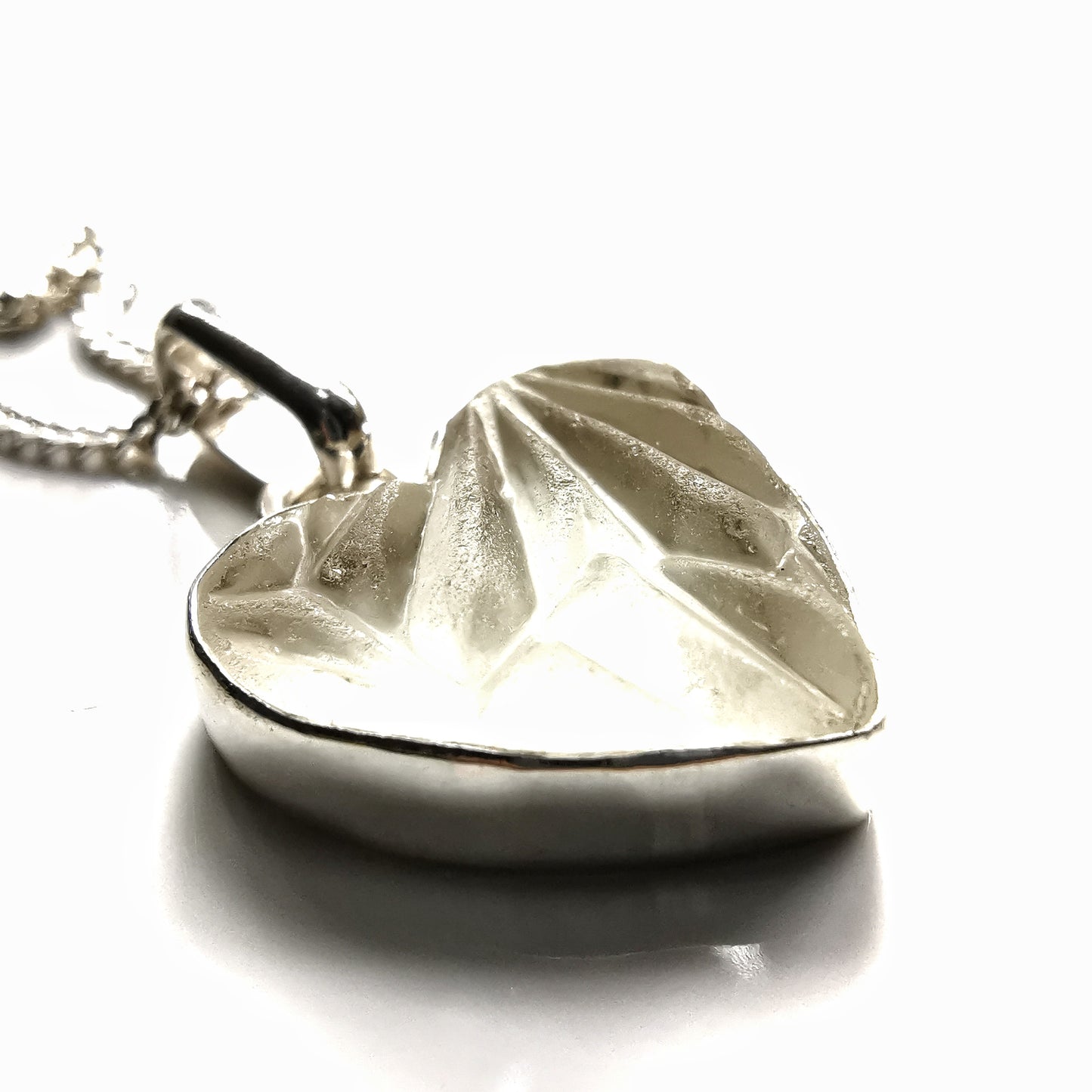 Clear sea glass heart & sterling silver pendant.