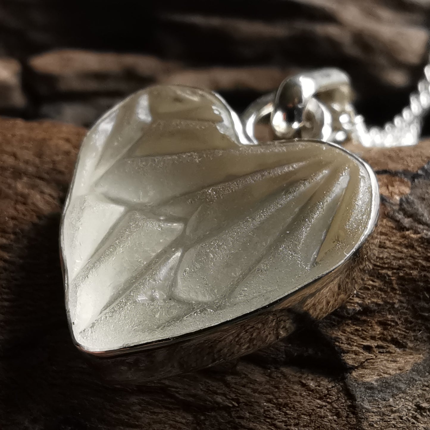 Clear sea glass heart & sterling silver pendant.