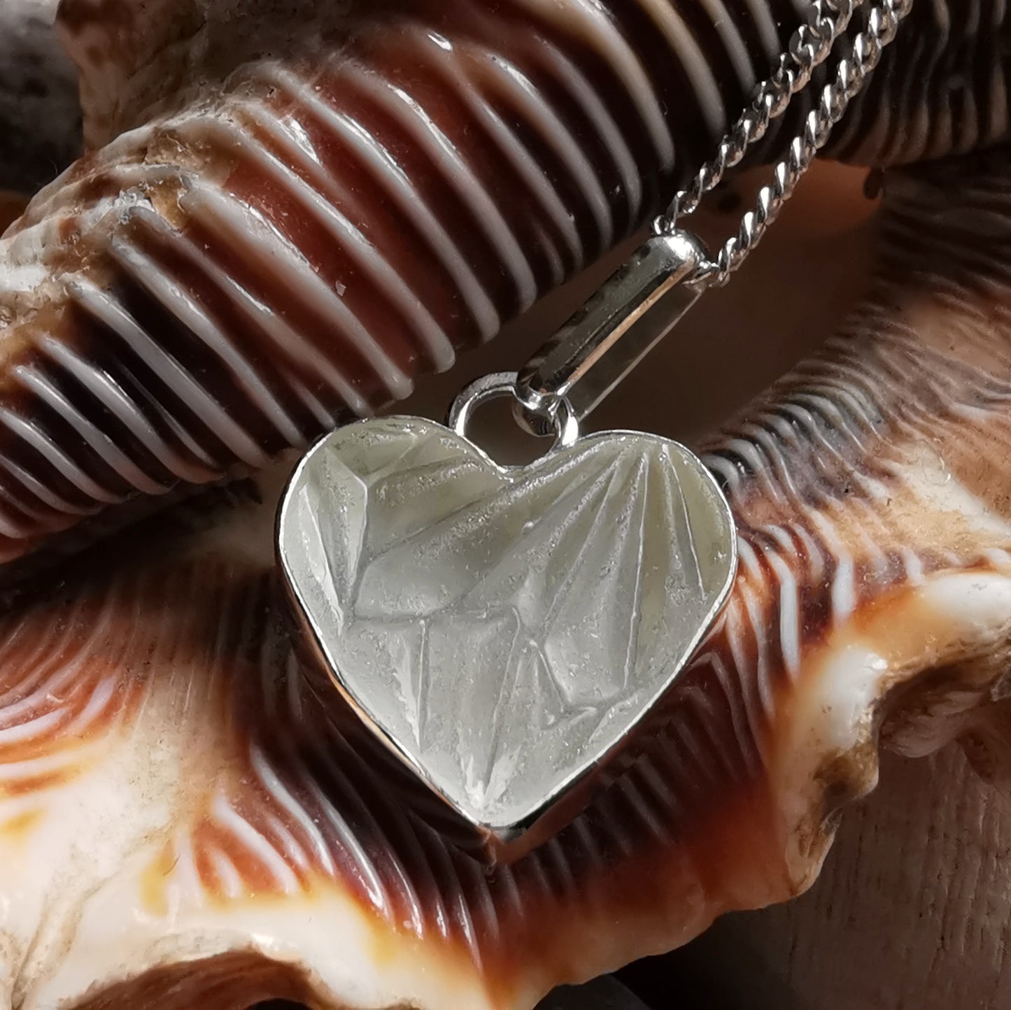 Clear sea glass heart & sterling silver pendant.