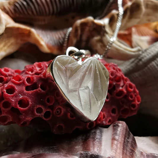 Clear sea glass heart & sterling silver pendant.