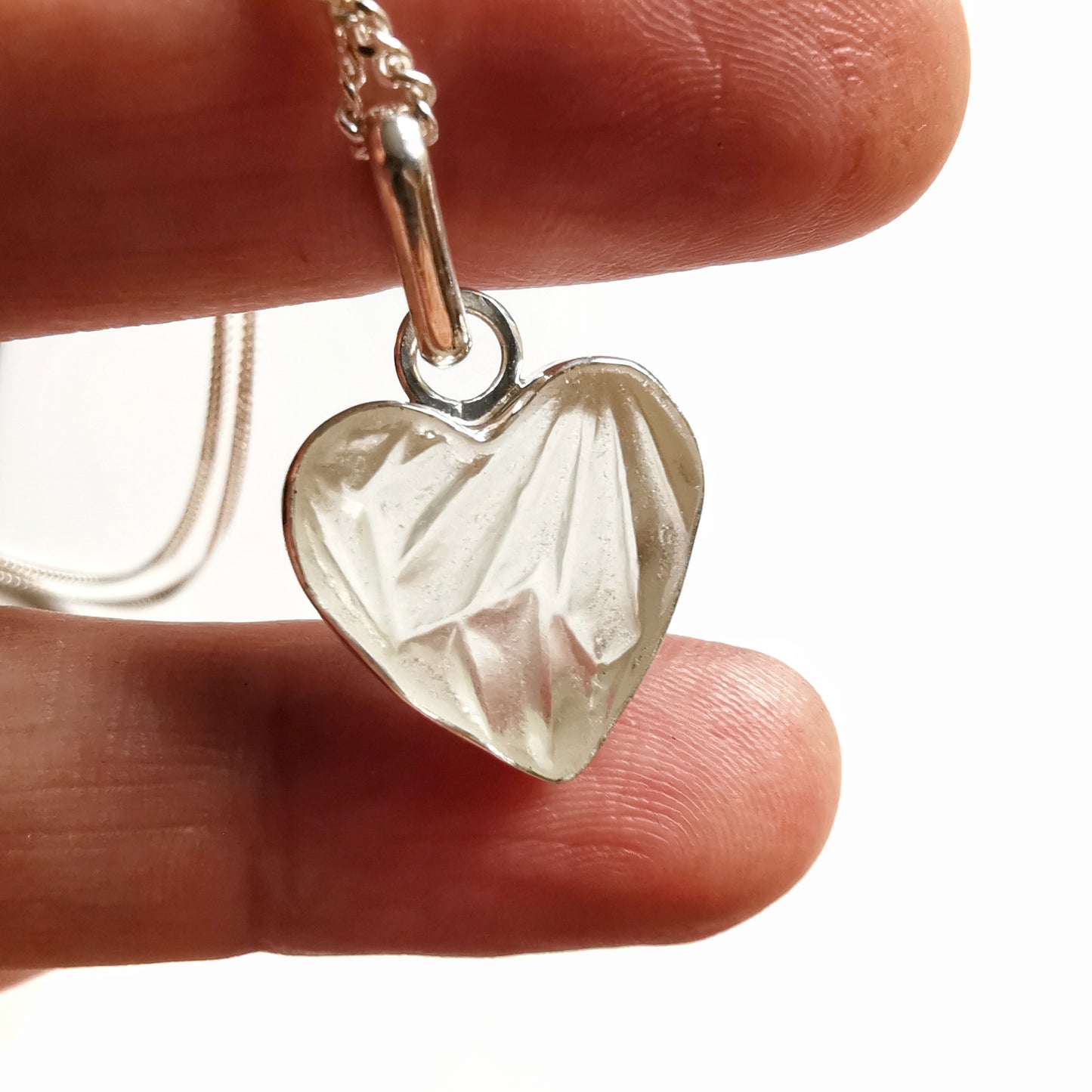 Clear sea glass heart & sterling silver pendant.