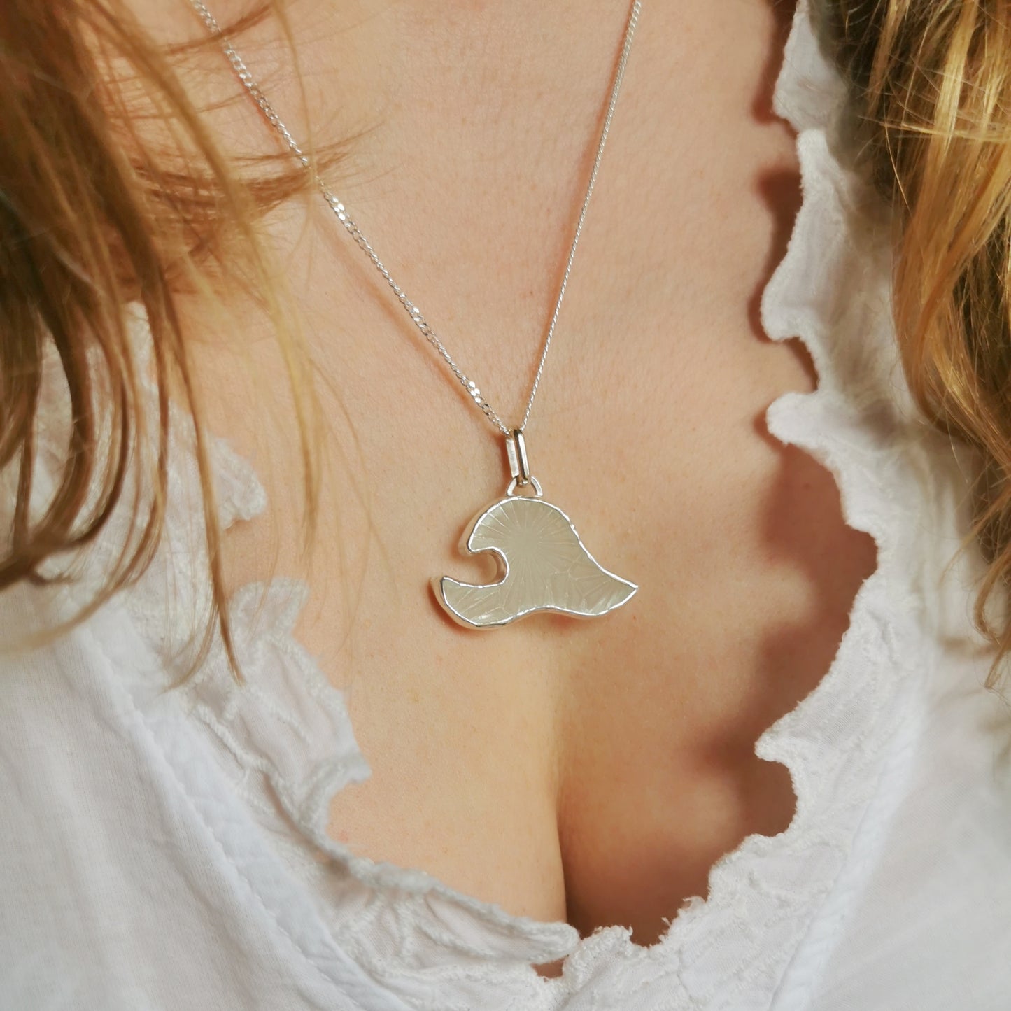 Scottish clear sea glass wave & sterling silver pendant.