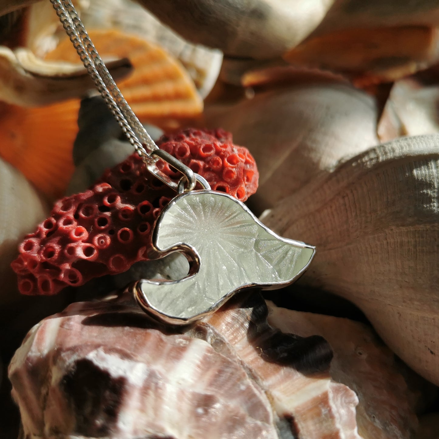 Scottish clear sea glass wave & sterling silver pendant.