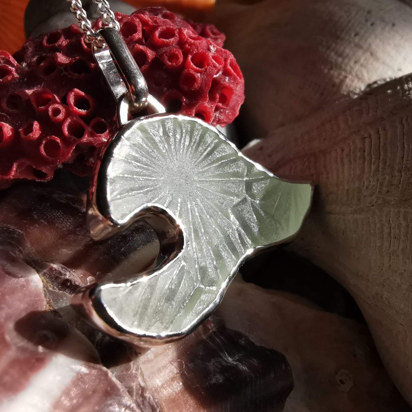 Scottish clear sea glass wave & sterling silver pendant.