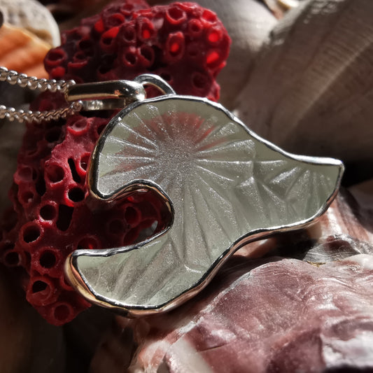 Scottish clear sea glass wave & sterling silver pendant.