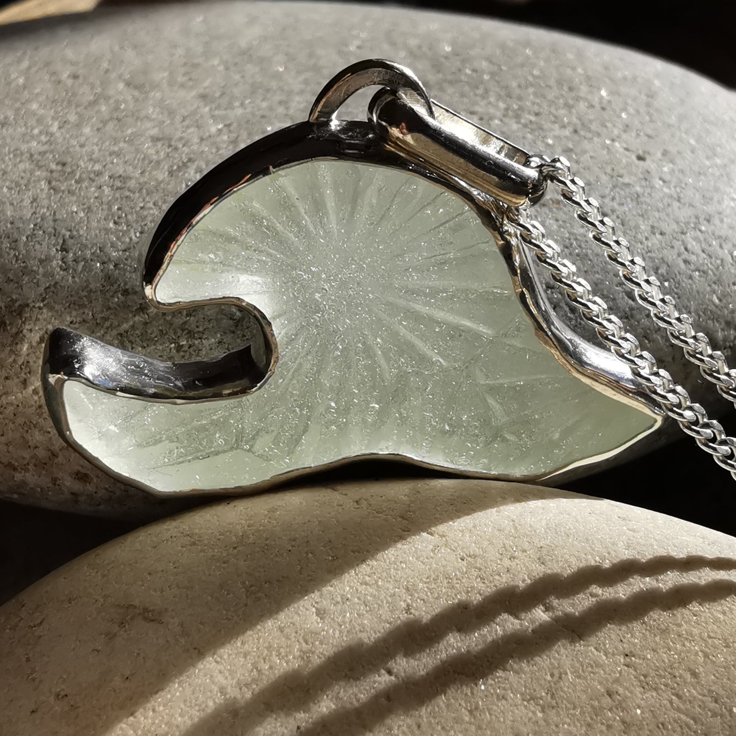 Scottish clear sea glass wave & sterling silver pendant.