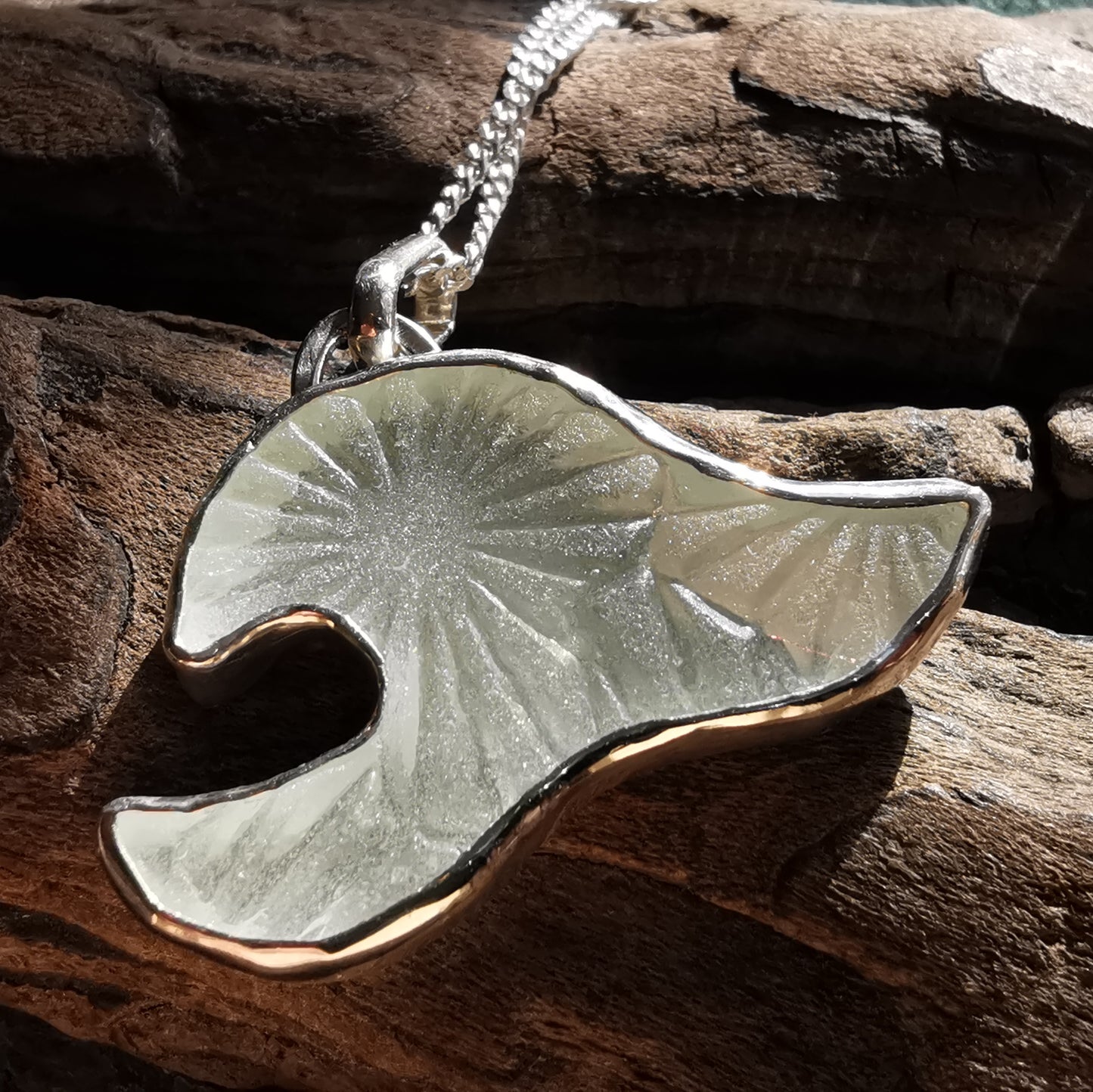 Scottish clear sea glass wave & sterling silver pendant.