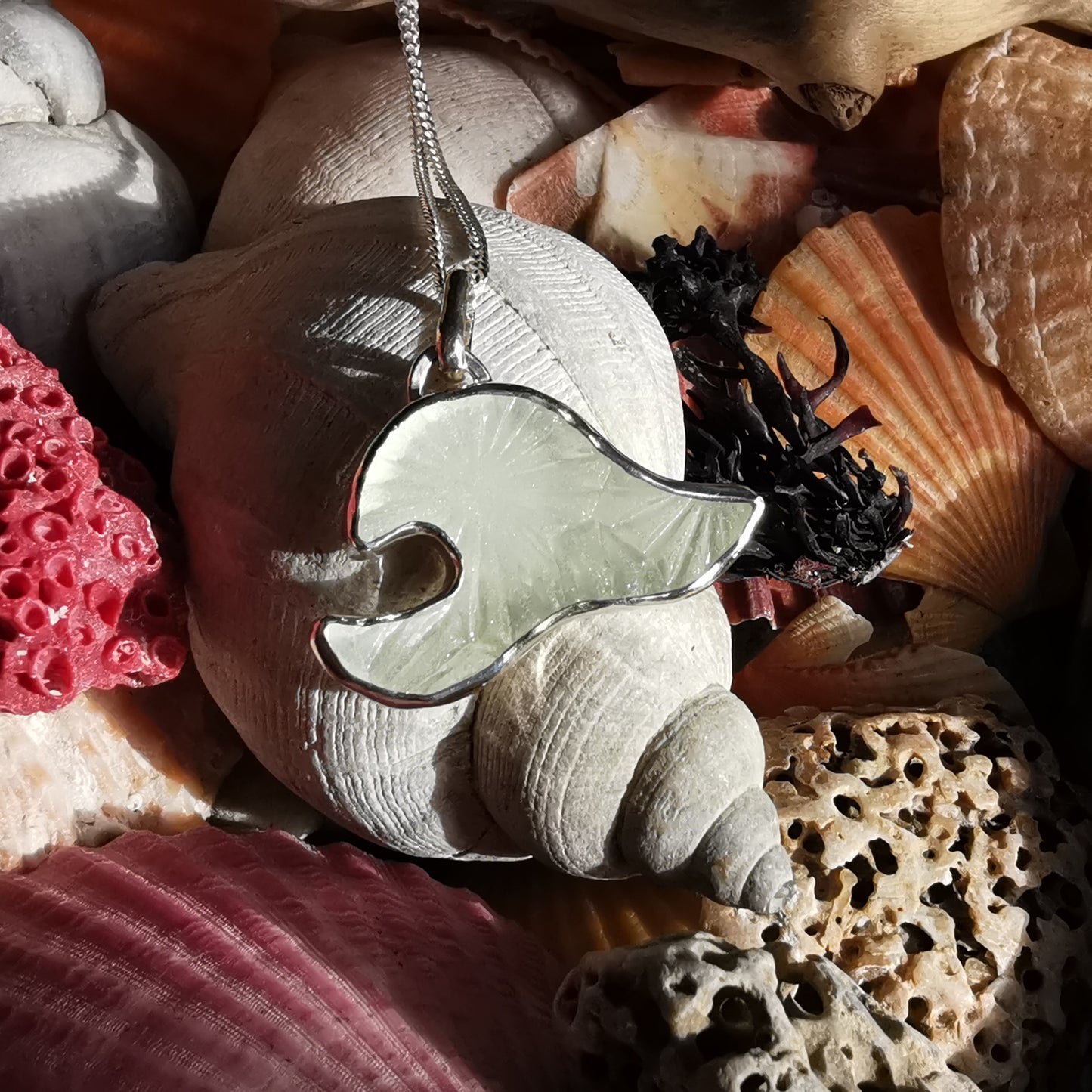 Scottish clear sea glass wave & sterling silver pendant.