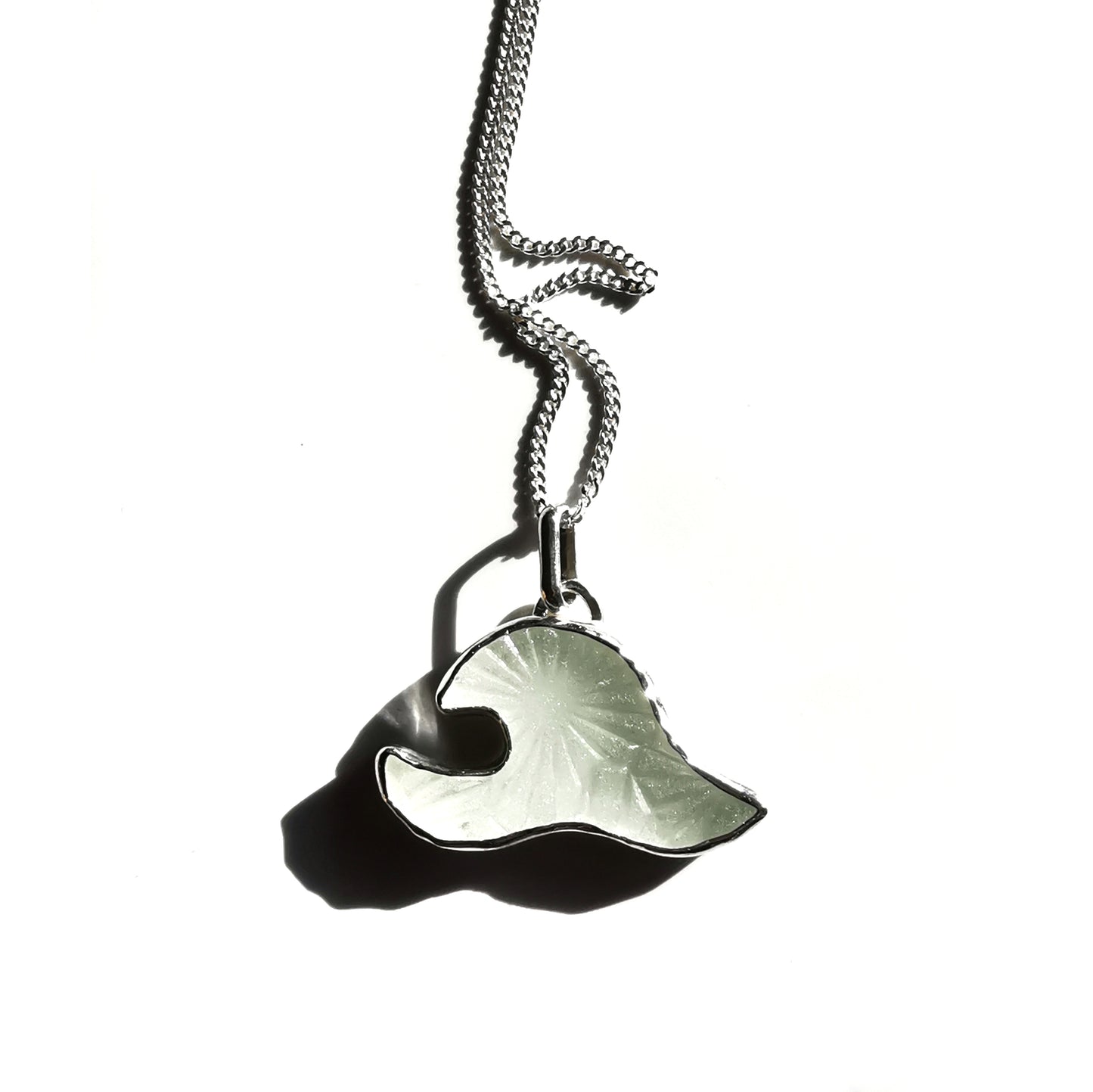Scottish clear sea glass wave & sterling silver pendant.