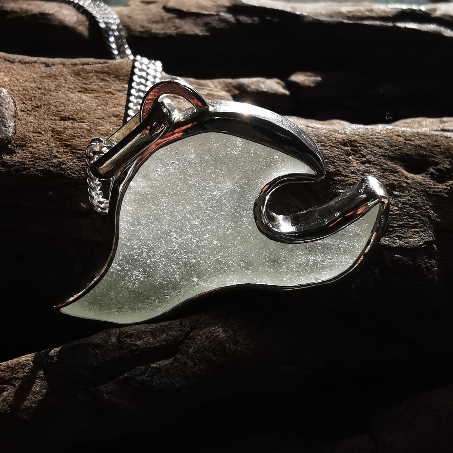 Scottish clear sea glass wave & sterling silver pendant.