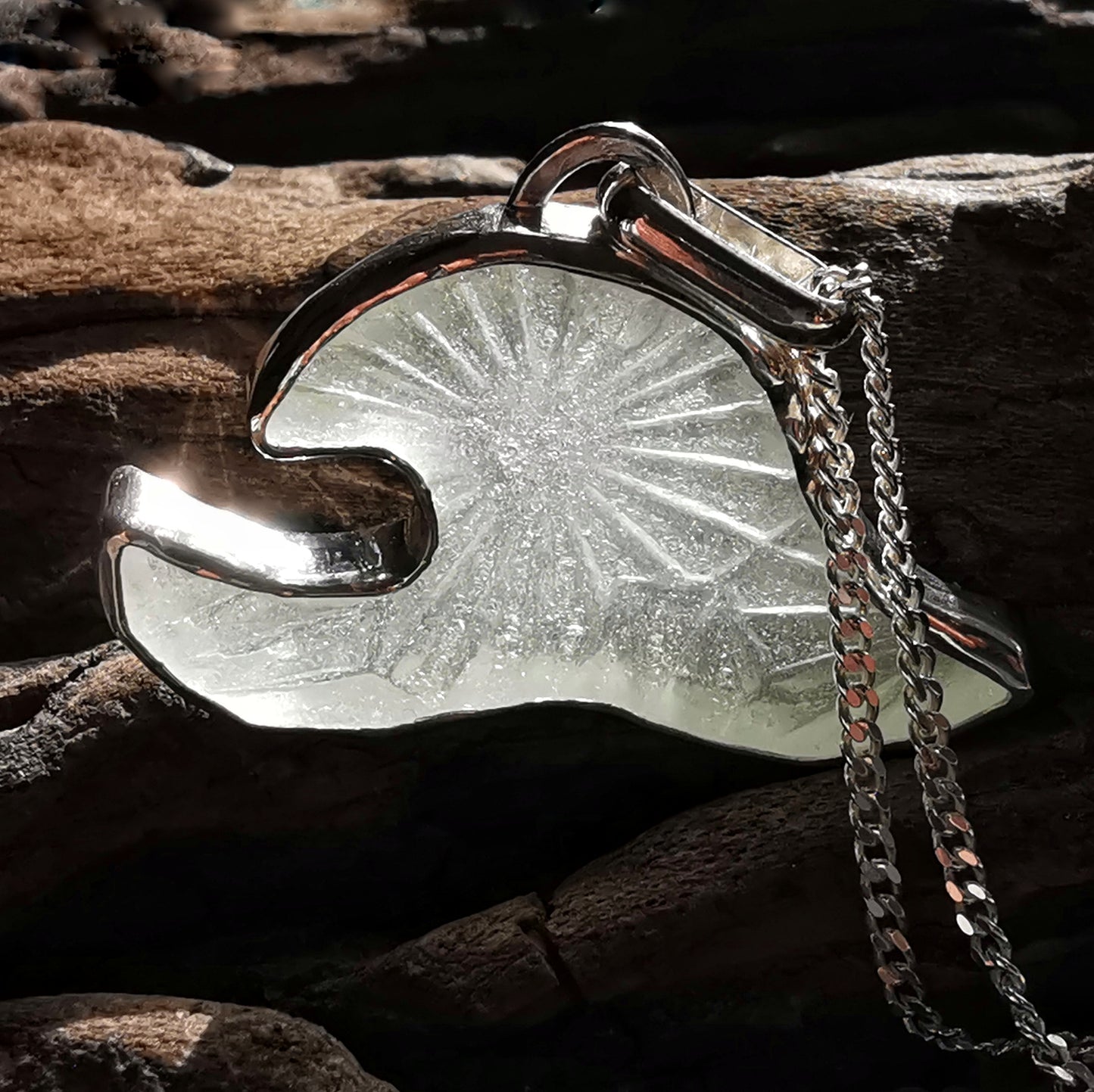 Scottish clear sea glass wave & sterling silver pendant.