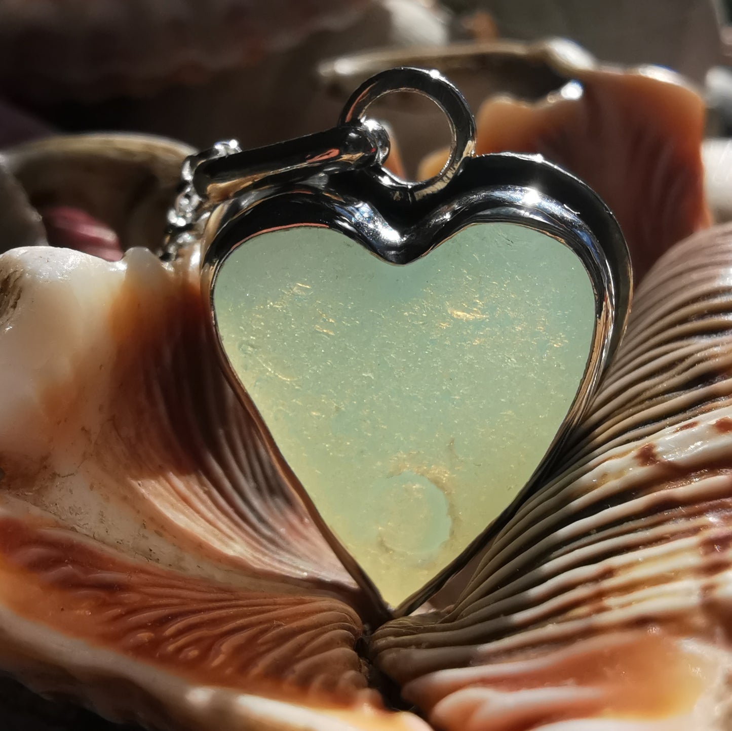 Reserved. Opalescent sea glass heart & sterling silver pendant.