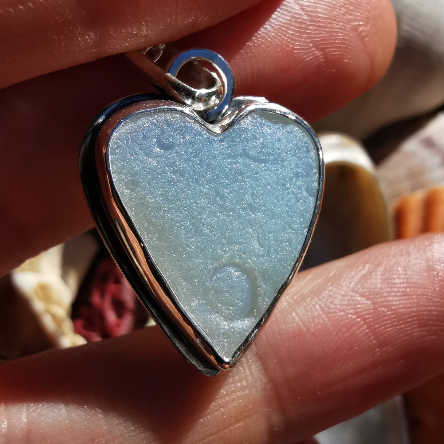 Reserved. Opalescent sea glass heart & sterling silver pendant.
