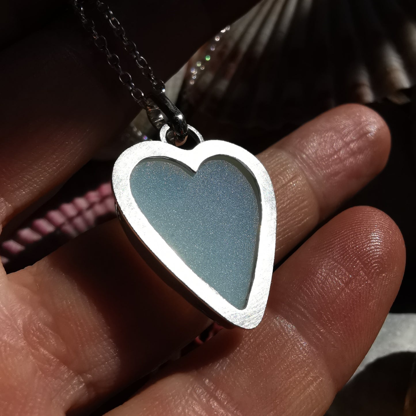 Reserved. Opalescent sea glass heart & sterling silver pendant.