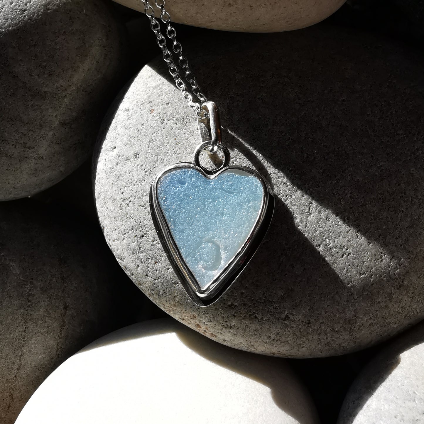 Reserved. Opalescent sea glass heart & sterling silver pendant.
