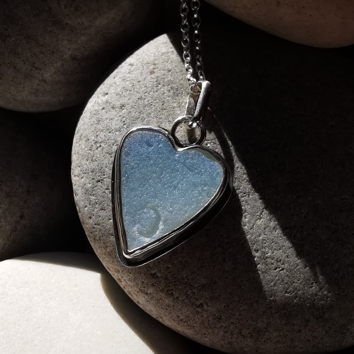 Reserved. Opalescent sea glass heart & sterling silver pendant.