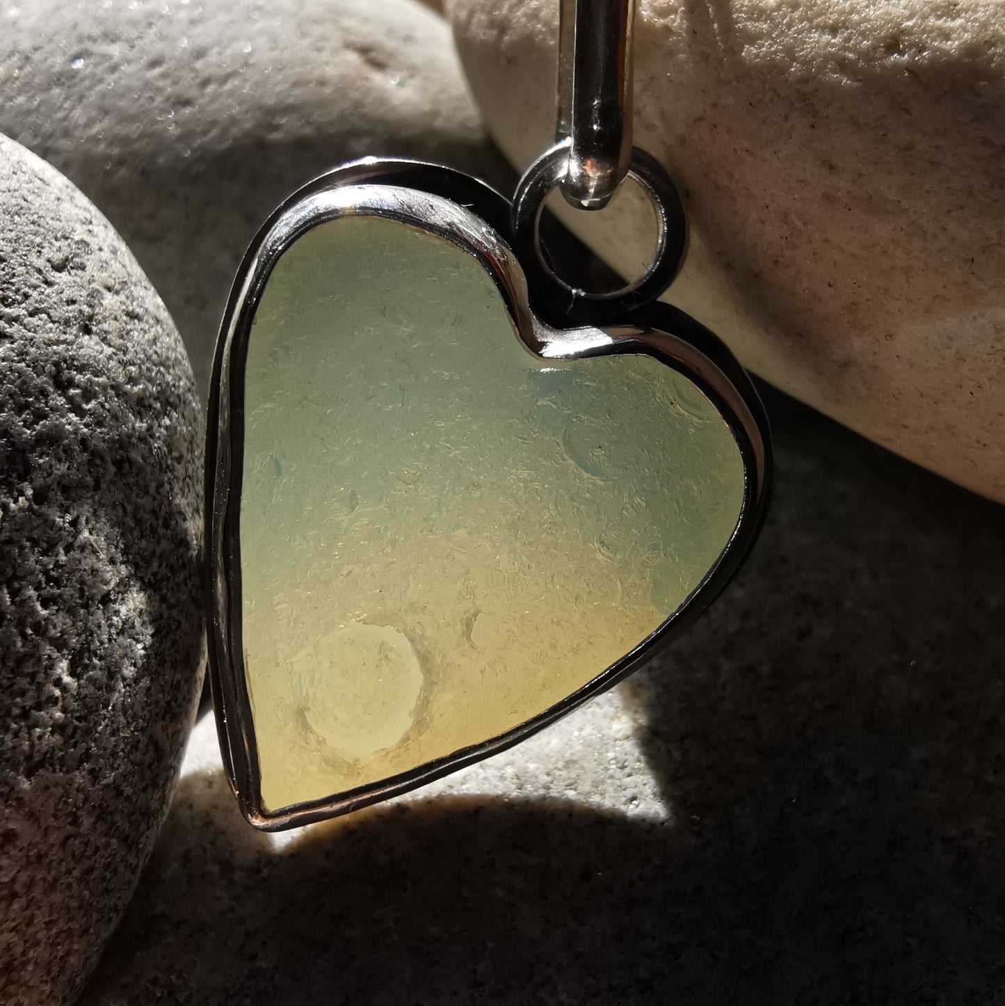 Reserved. Opalescent sea glass heart & sterling silver pendant.
