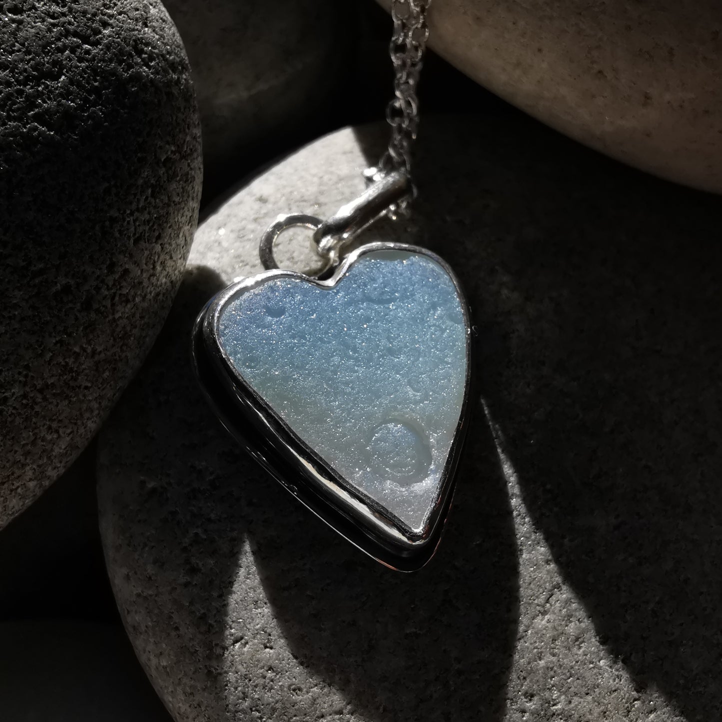 Reserved. Opalescent sea glass heart & sterling silver pendant.